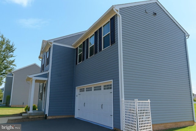 2414 Post Oak, Culpeper, VA 22701 - view of side of home with an attached garage and asphalt driveway