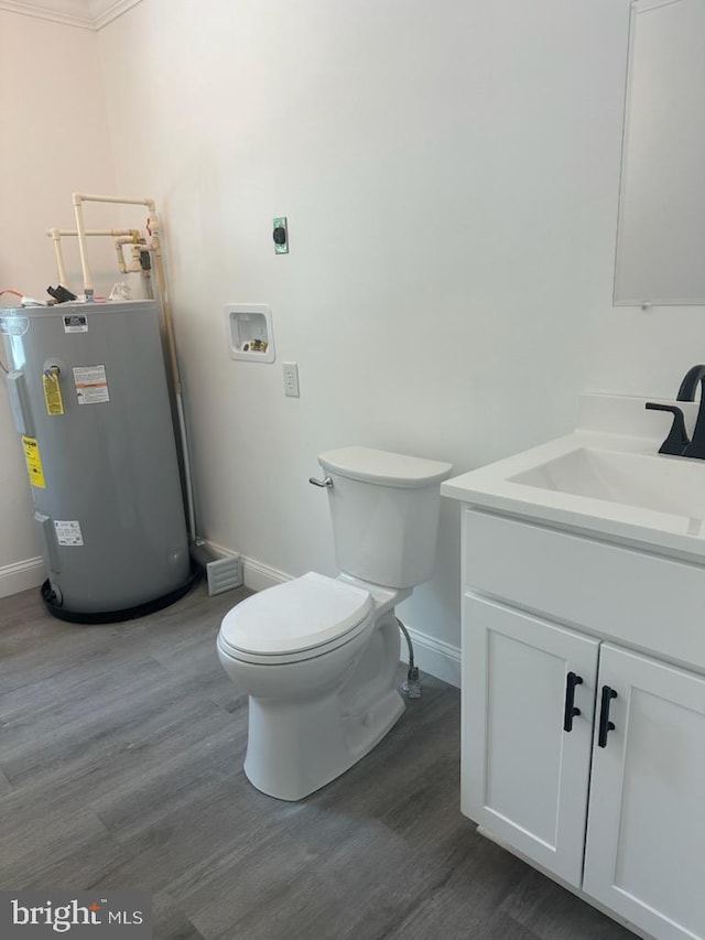 8357 Gannon Cir, Easton, MD 21601 - bathroom featuring electric water heater, vanity, and wood finished floors