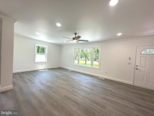 8357 Gannon Cir, Easton, MD 21601 - unfurnished living room with crown molding, plenty of natural light, a ceiling fan, dark wood-type flooring, and recessed lighting