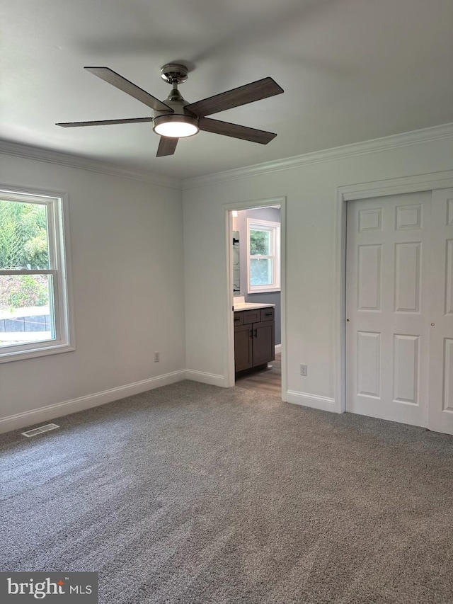 8357 Gannon Cir, Easton, MD 21601 - unfurnished bedroom featuring ornamental molding, carpet, a closet, ensuite bath, and a ceiling fan