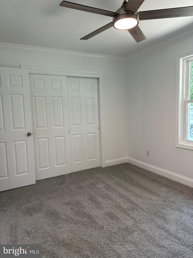 8357 Gannon Cir, Easton, MD 21601 - unfurnished bedroom with crown molding, carpet floors, a closet, and a ceiling fan