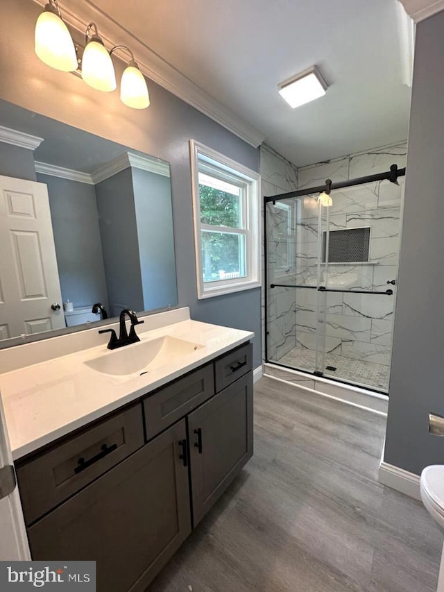 8357 Gannon Cir, Easton, MD 21601 - bathroom with crown molding, vanity, wood finished floors, and a marble finish shower