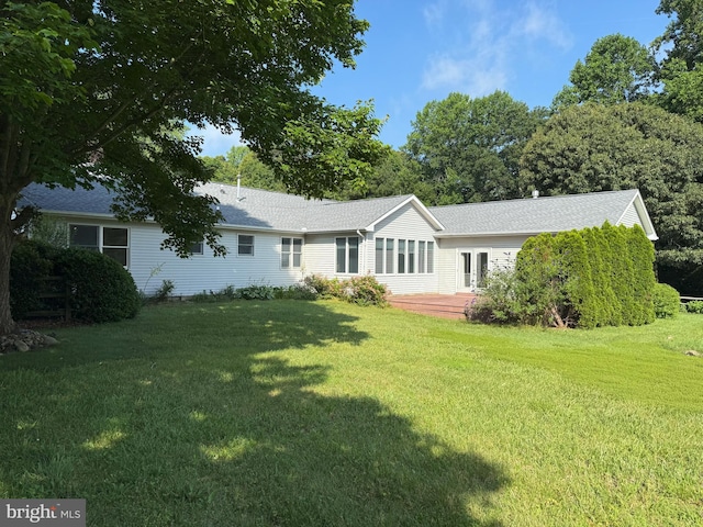 5 Michael Ct, Rehoboth Beach, DE 19971 - view of front of house featuring a front lawn and a wooden deck