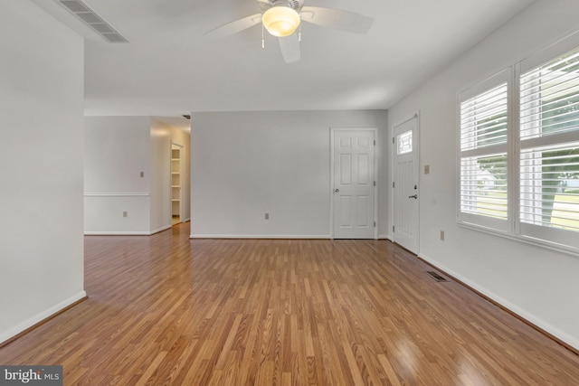 5 Michael Ct, Rehoboth Beach, DE 19971 - unfurnished living room featuring light wood-type flooring and ceiling fan