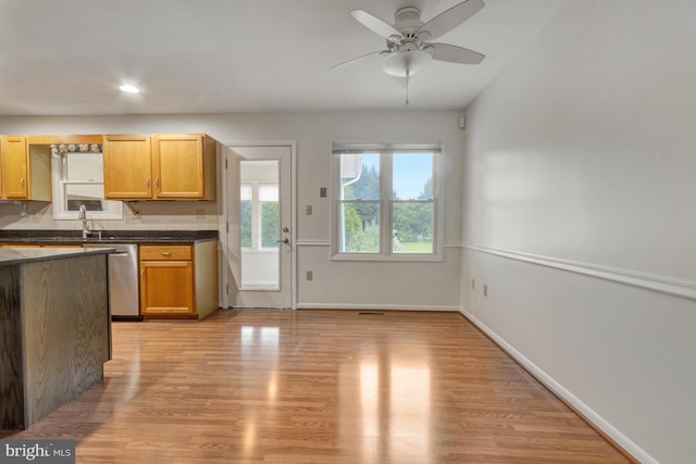 5 Michael Ct, Rehoboth Beach, DE 19971 - kitchen with dishwasher, light wood-style flooring, dark countertops, a ceiling fan, and recessed lighting