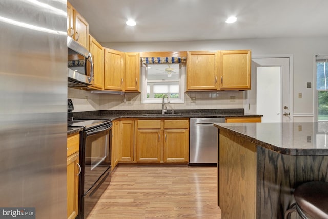 5 Michael Ct, Rehoboth Beach, DE 19971 - kitchen with stainless steel appliances, light wood-style flooring, plenty of natural light, decorative backsplash, and recessed lighting
