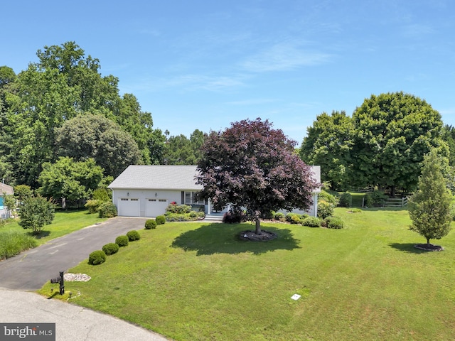5 Michael Ct, Rehoboth Beach, DE 19971 - view of front of property with an attached garage, asphalt driveway, and a front lawn