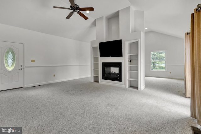 5 Michael Ct, Rehoboth Beach, DE 19971 - unfurnished living room featuring lofted ceiling, a ceiling fan, carpet flooring, and a multi sided fireplace