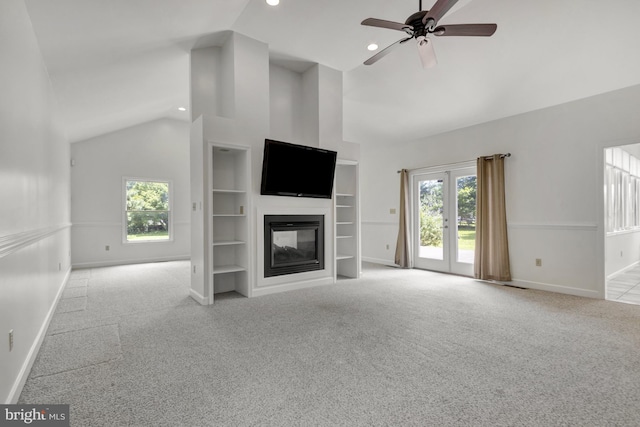 5 Michael Ct, Rehoboth Beach, DE 19971 - unfurnished living room featuring carpet, healthy amount of natural light, ceiling fan, a multi sided fireplace, and high vaulted ceiling