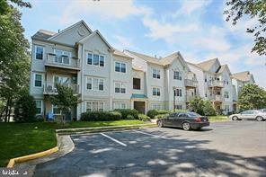 12491 Hayes Ct Unit 303, Fairfax, VA 22033 - view of property featuring uncovered parking and a residential view