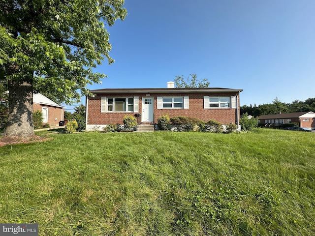 901 Vanderwood Rd, Baltimore, MD 21228 - ranch-style house with brick siding, a front yard, and a chimney