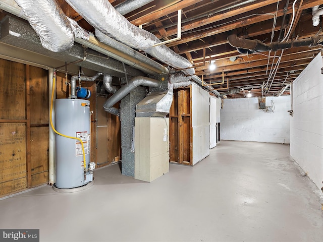 901 Vanderwood Rd, Baltimore, MD 21228 - unfinished basement with gas water heater, heating unit, and concrete block wall
