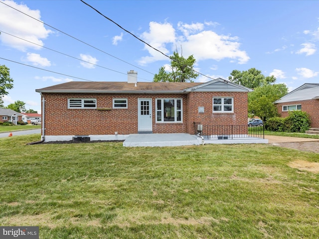 901 Vanderwood Rd, Baltimore, MD 21228 - rear view of property with brick siding, a yard, and a patio
