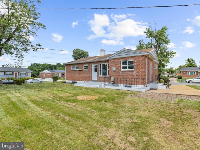 901 Vanderwood Rd, Baltimore, MD 21228 - back of property with brick siding and a yard