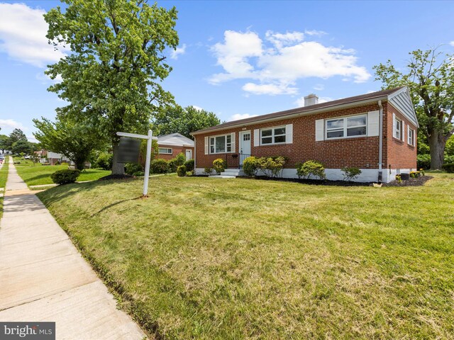 901 Vanderwood Rd, Baltimore, MD 21228 - view of front of property featuring brick siding and a front lawn