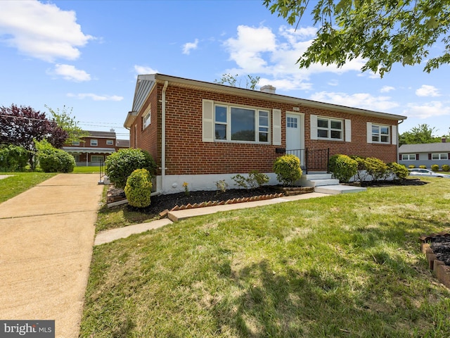 901 Vanderwood Rd, Baltimore, MD 21228 - view of front of house with brick siding and a front yard