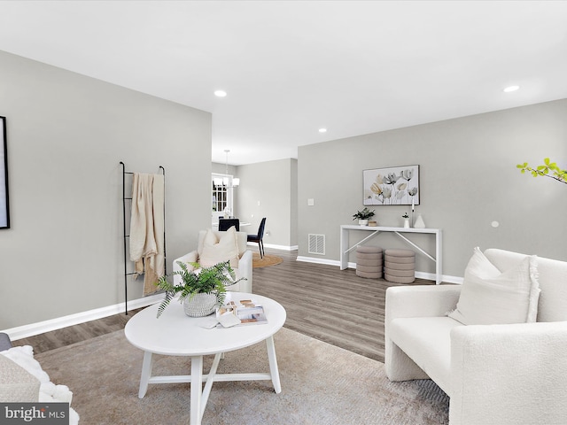 901 Vanderwood Rd, Baltimore, MD 21228 - living room with wood finished floors, a chandelier, and recessed lighting