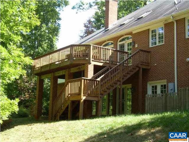 3190 Prestwick Pl, Keswick, VA 22947 - back of house with stairs, a chimney, a deck, and brick siding