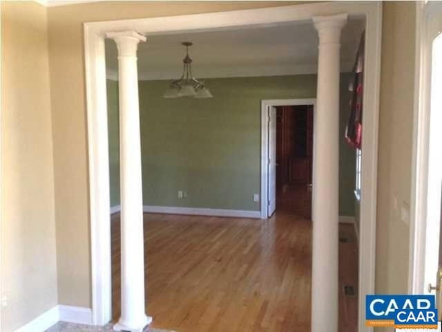3190 Prestwick Pl, Keswick, VA 22947 - hall featuring light wood finished floors and ornate columns