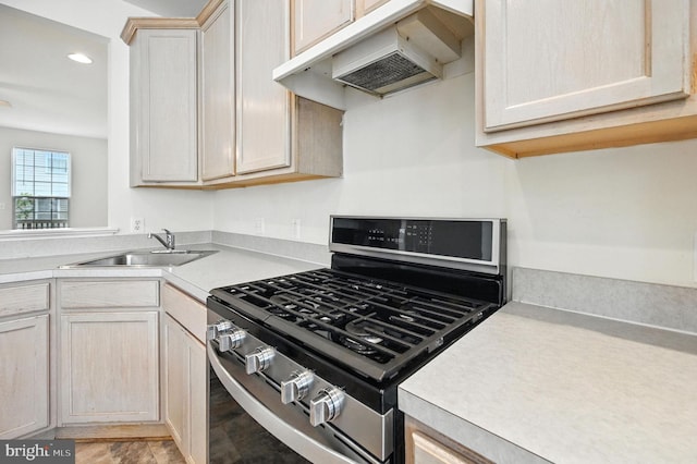 6949 Banchory Ct, Alexandria, VA 22315 - kitchen featuring stainless steel gas range oven, under cabinet range hood, light countertops, and recessed lighting