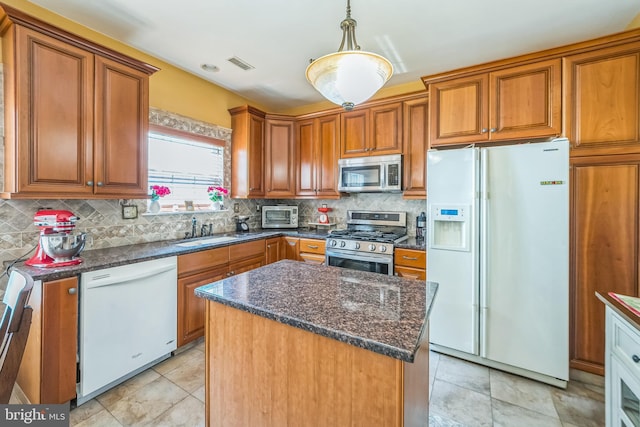 15 Kresson Ct, Berlin, NJ 08009 - kitchen with appliances with stainless steel finishes, brown cabinetry, backsplash, hanging light fixtures, and a kitchen island