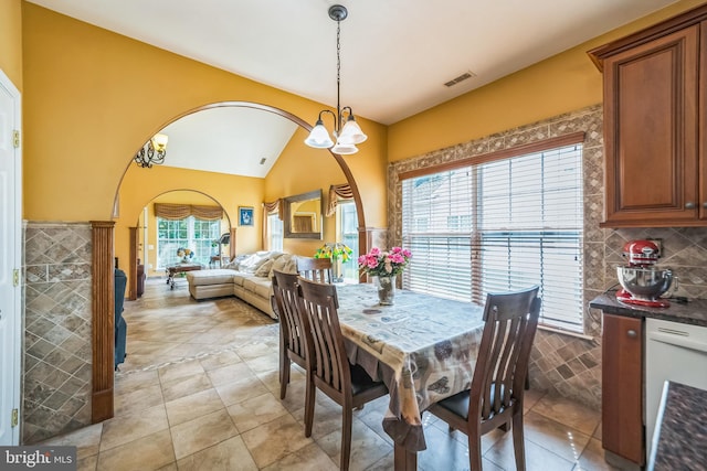 15 Kresson Ct, Berlin, NJ 08009 - dining area with arched walkways, vaulted ceiling, light tile patterned floors, and a chandelier