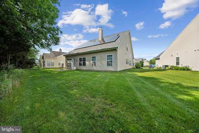 15 Kresson Ct, Berlin, NJ 08009 - back of property featuring solar panels, a yard, and a chimney