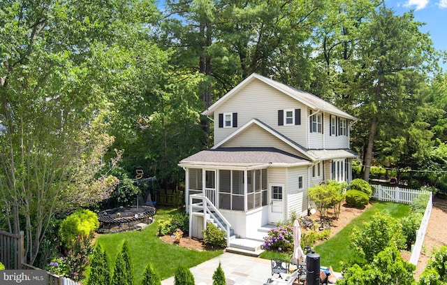201 Pennsylvania Ave, Falls Church, VA 22046 - view of front of property with a sunroom, a shingled roof, and view of scattered trees