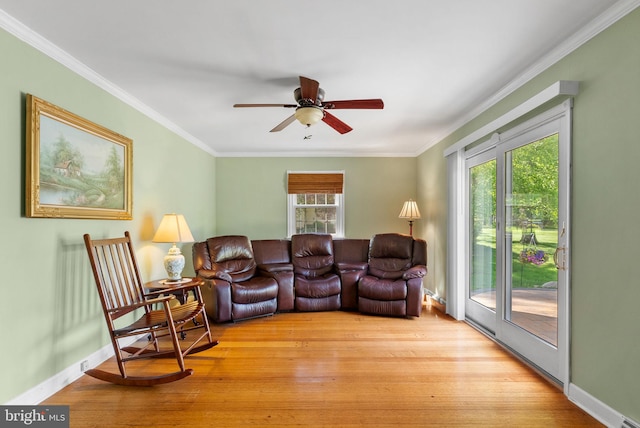 108 Walker Rd, Washington Crossing, PA 18977 - living room featuring a ceiling fan, ornamental molding, and light wood-style flooring