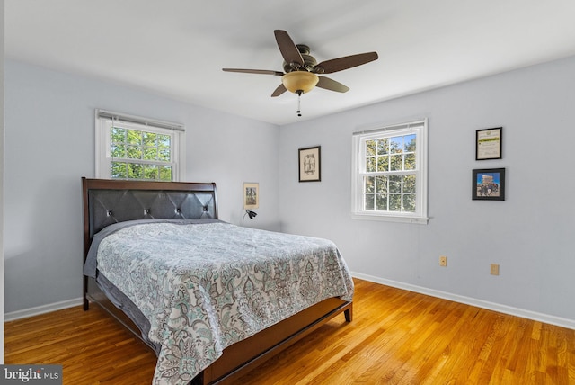 108 Walker Rd, Washington Crossing, PA 18977 - bedroom featuring multiple windows, wood finished floors, and a ceiling fan