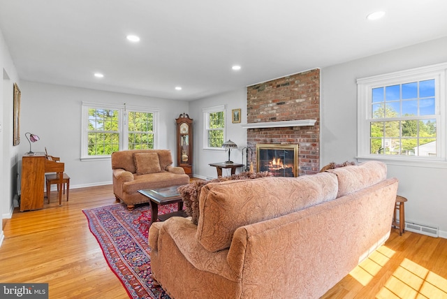 108 Walker Rd, Washington Crossing, PA 18977 - living area with healthy amount of natural light, light wood-type flooring, a brick fireplace, and recessed lighting