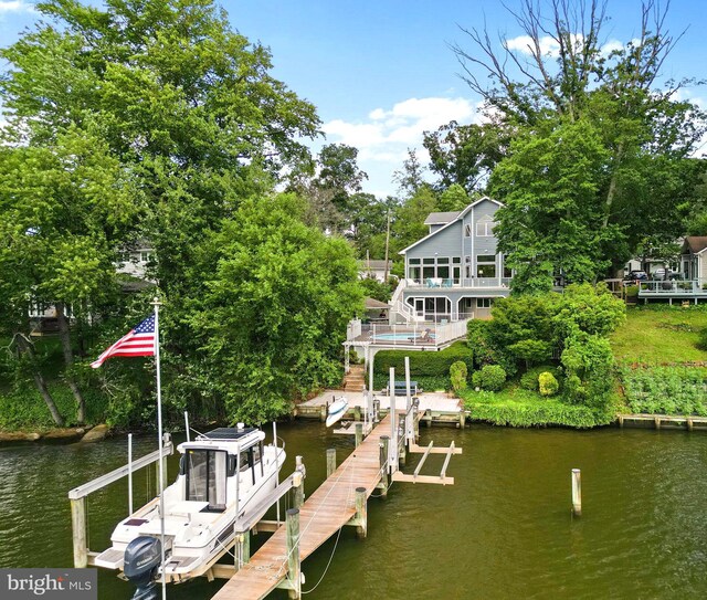 734 Oak Grove Cir, Severna Park, MD 21146 - dock featuring boat lift, a water view, and view of scattered trees