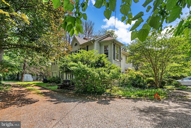 13321 Travilah Rd, Potomac, MD 20854 - view of front facade with a storage shed and driveway