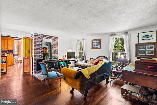 13321 Travilah Rd, Potomac, MD 20854 - living room with a wood stove, hardwood / wood-style flooring, a textured ceiling, and ornamental molding