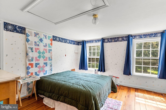 13321 Travilah Rd, Potomac, MD 20854 - bedroom with hardwood / wood-style floors, multiple windows, attic access, and wallpapered walls