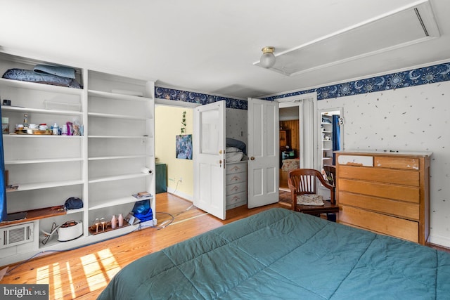 13321 Travilah Rd, Potomac, MD 20854 - bedroom featuring attic access, wood finished floors, and wallpapered walls
