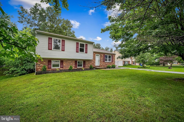 5315 Debbie Ct, Ellicott City, MD 21043 - tri-level home featuring a front yard and brick siding