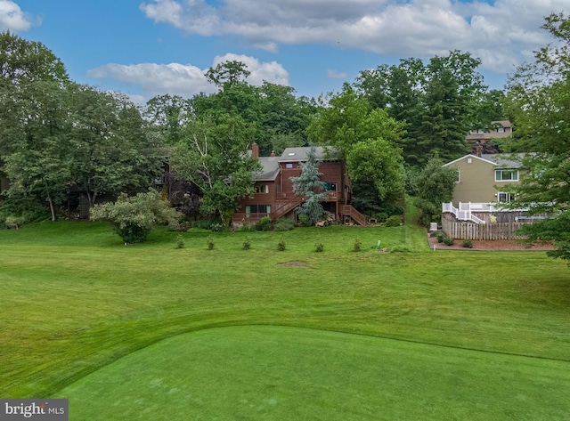 16 Golfview Ln, Reading, PA 19606 - view of community featuring stairs, a deck, a yard, view of scattered trees, and golf course view