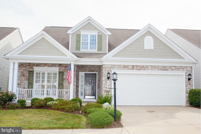147 Saddletop Dr Unit 381, Taneytown, MD 21787 - view of front of property featuring stone siding, covered porch, driveway, and an attached garage