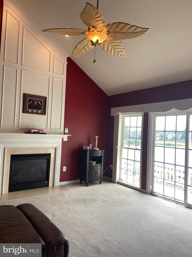 147 Saddletop Dr Unit 381, Taneytown, MD 21787 - living room with lofted ceiling, carpet, a ceiling fan, and a glass covered fireplace
