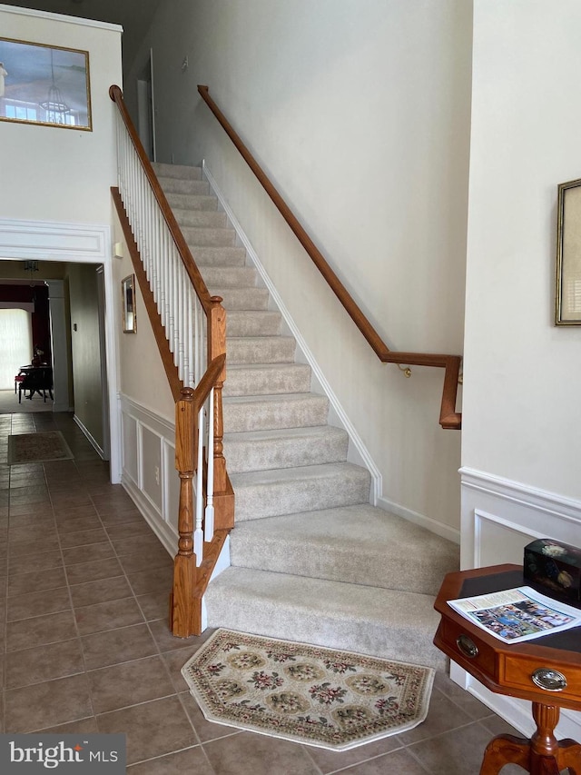 147 Saddletop Dr Unit 381, Taneytown, MD 21787 - staircase featuring tile patterned floors and a high ceiling