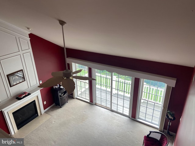 147 Saddletop Dr Unit 381, Taneytown, MD 21787 - living area with ceiling fan, healthy amount of natural light, light carpet, vaulted ceiling, and a fireplace with flush hearth