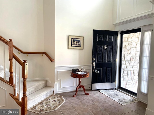 147 Saddletop Dr Unit 381, Taneytown, MD 21787 - entrance foyer featuring stairs, tile patterned floors, and a decorative wall