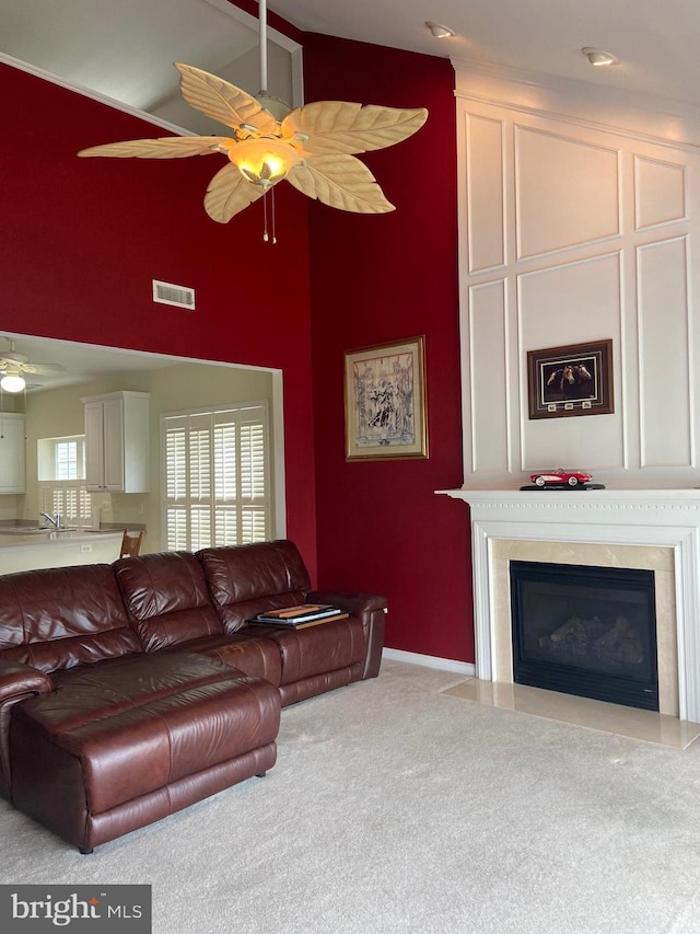 147 Saddletop Dr Unit 381, Taneytown, MD 21787 - carpeted living room with a ceiling fan, high vaulted ceiling, and a fireplace with flush hearth
