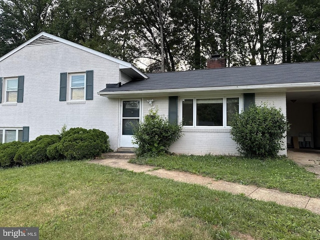5505 Heming Ave, Springfield, VA 22151 - split level home featuring brick siding, a front yard, and a chimney