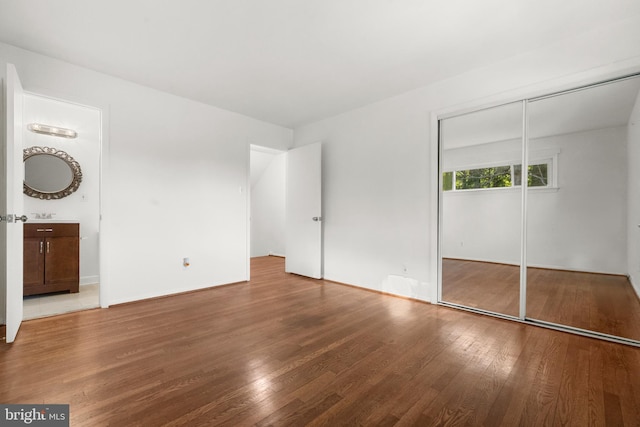 5505 Heming Ave, Springfield, VA 22151 - unfurnished bedroom featuring wood finished floors and a closet
