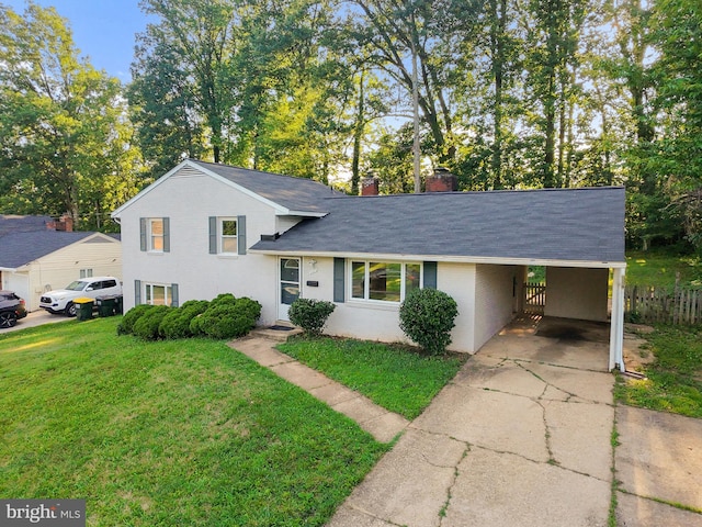 5505 Heming Ave, Springfield, VA 22151 - tri-level home with a front yard, a chimney, brick siding, driveway, and a carport