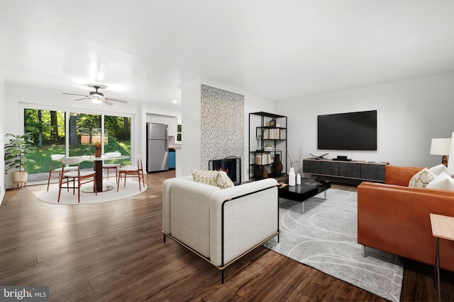 5505 Heming Ave, Springfield, VA 22151 - living area featuring wood finished floors, a ceiling fan, and a fireplace