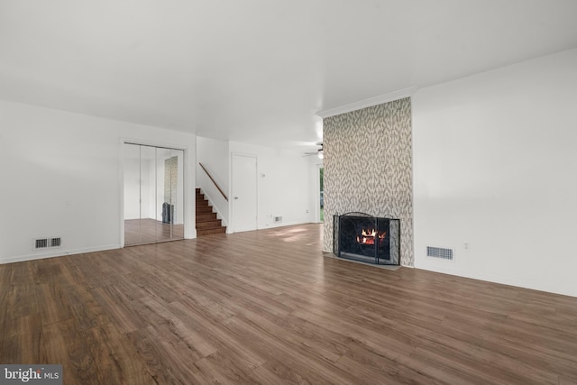 5505 Heming Ave, Springfield, VA 22151 - unfurnished living room with a fireplace, wood finished floors, stairs, and ceiling fan