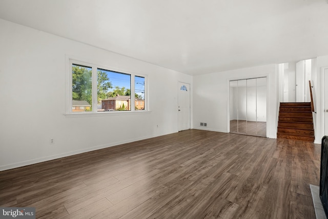5505 Heming Ave, Springfield, VA 22151 - unfurnished living room with dark wood-style floors and stairs